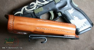 Specially designed belt hook allows shirt to be tucked in over the pistol.