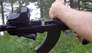 Right-handed charging over the top of the rifle